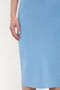 Close-up of a person wearing a Fitted Midi Skirt In Marina from Victoria Beckham, showing their hand resting at their side.