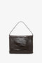 A versatile Jumbo Chain Pouch Bag In Chocolate Croc-Effect Leather by Victoria Beckham with a single shoulder strap, perfect for any occasion.