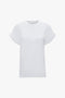 A Victoria Beckham Asymmetric Relaxed Fit T-Shirt In White with asymmetric folded sleeves is displayed against a white background.