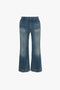 Blue denim Cropped Kick Jeans in Indigrey Wash by Victoria Beckham, isolated on a white background.