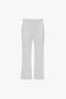 A pair of Victoria Beckham Exclusive Cropped Tuxedo Trouser In Ivory with tailored high waist, belt loops, front zipper, and pockets, displayed against a plain white background.