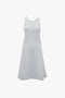 A body-sculpting, sleeveless boucle knit dress with a knee-length cut and an A-line skirt, the Sleeveless Tank Dress In Ice by Victoria Beckham, is displayed on a white background.