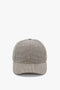 A front view of a Victoria Beckham Logo Cap In Dogtooth Check with a curved brim, isolated on a white background.