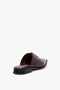 A single "Flat Lace Up Mules In Bordeaux Leather" by Victoria Beckham is displayed against a white background.