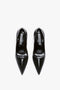 A pair of black pointed-toe high-heeled V Pump In Black Brushed Leather by Victoria Beckham featuring sculptural heels viewed from above on a white background.