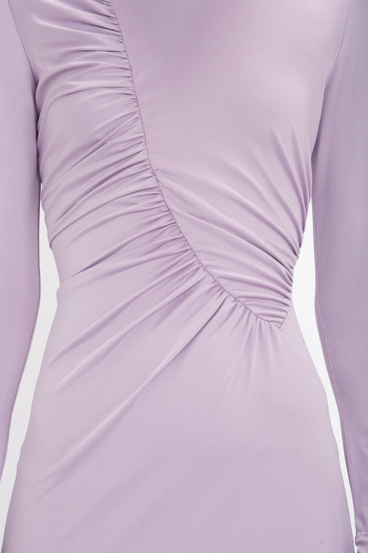Close-up of a Victoria Beckham Ruched Detail Floor-Length Gown In Petunia in stretch jersey with gathered, ruched detailing along the front.