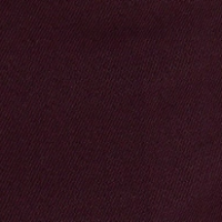 Close-up of dark maroon fabric texture with a smooth and slightly ribbed surface, reminiscent of the luxurious feel found in Victoria Beckham's Alina Trouser In Deep Mahogany.