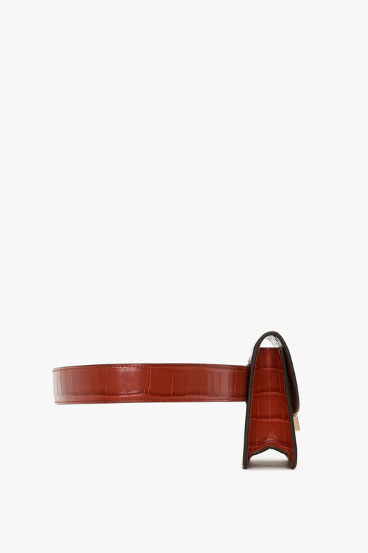 Nano Dorian Belt Bag In Brick Red Croc Embossed Leather