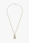 An Exclusive Frame Necklace In Gold by Victoria Beckham with a thin chain and a pendant featuring two vertical rectangular shapes linked together, echoing the elegant simplicity found in Victoria Beckham accessories.