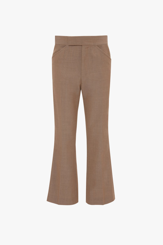 A pair of Victoria Beckham Wide Cropped Flare Trouser In Tobacco with a slight flare at the bottom and front pleats, reminiscent of classic 1970s-inspired trousers.