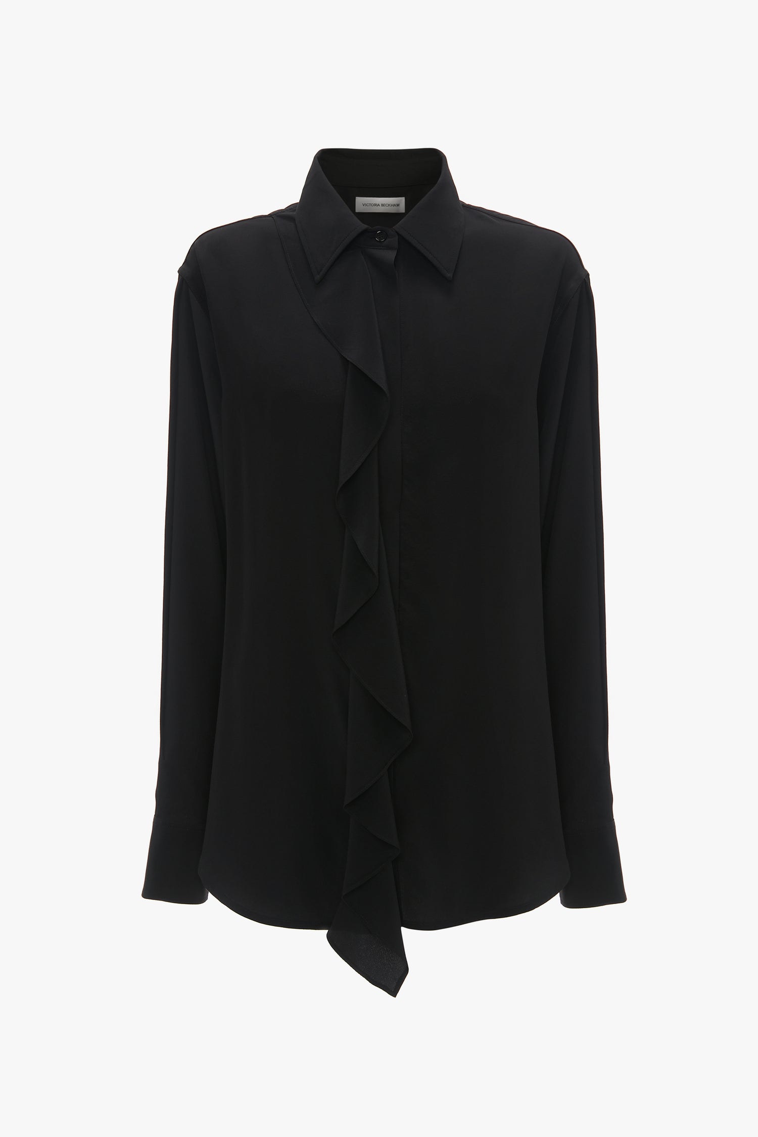 An Asymmetric Ruffle Blouse In Black by Victoria Beckham featuring a front asymmetric ruffle drape, collar, and button-down closure, embodying contemporary timeless fashion.