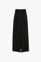 Deconstructed Floor-Length Skirt In Black by Victoria Beckham with white stitching details, featuring front and side pockets and a straight hemline that provides an elongating silhouette.