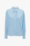 Light blue-and-white striped button-up shirt with long sleeves and a collar, inspired by Victoria Beckham's chic style, on a plain white background.