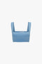 A blue sleeveless Strap Bandeau Top In Marina with a square neckline and wide shoulder straps, displayed on a plain white background by Victoria Beckham.