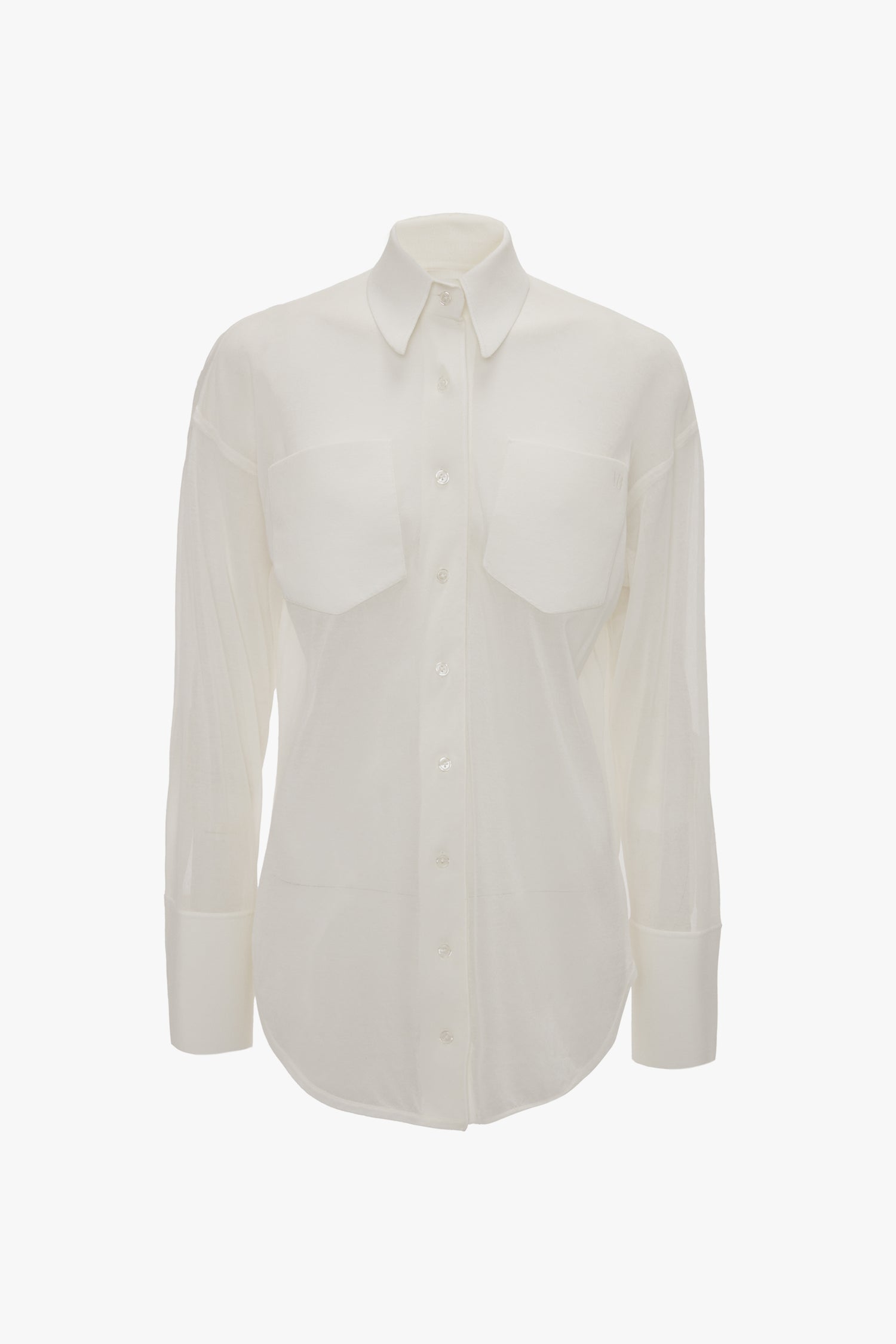 A white, long-sleeved Pocket Detail Shirt In White by Victoria Beckham with a relaxed fit, featuring two front pockets and a collar on a plain background.