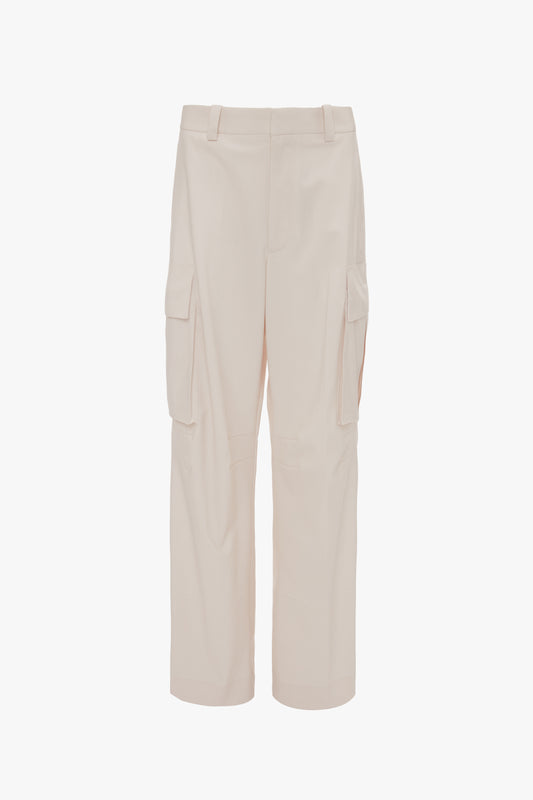 A pair of beige, military-inspired cargo trousers with a relaxed silhouette, multiple pockets, and belt loops, crafted from 100% cotton, displayed against a plain white background has been replaced with "Victoria Beckham's Relaxed Cargo Trouser In Bone.