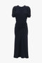 A knee-length, short-sleeved, Gathered Waist Midi Dress In Midnight by Victoria Beckham with a round neckline and a classic fit-and-flare silhouette featuring gathered detail at the waist.