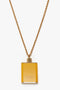 Gold brushed brass jewelry meets modern elegance with this Victoria Beckham Perfume Bottle Necklace In San Ysidro Drive, featuring a rectangular pendant that resembles a small flask.