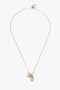 An exquisitely crafted in Italy, light gold necklace, the Exclusive Abstract Charm Necklace In Light Gold by Victoria Beckham, features a thin chain and two interlocking circular pendants, offering an abstract charm to any ensemble.