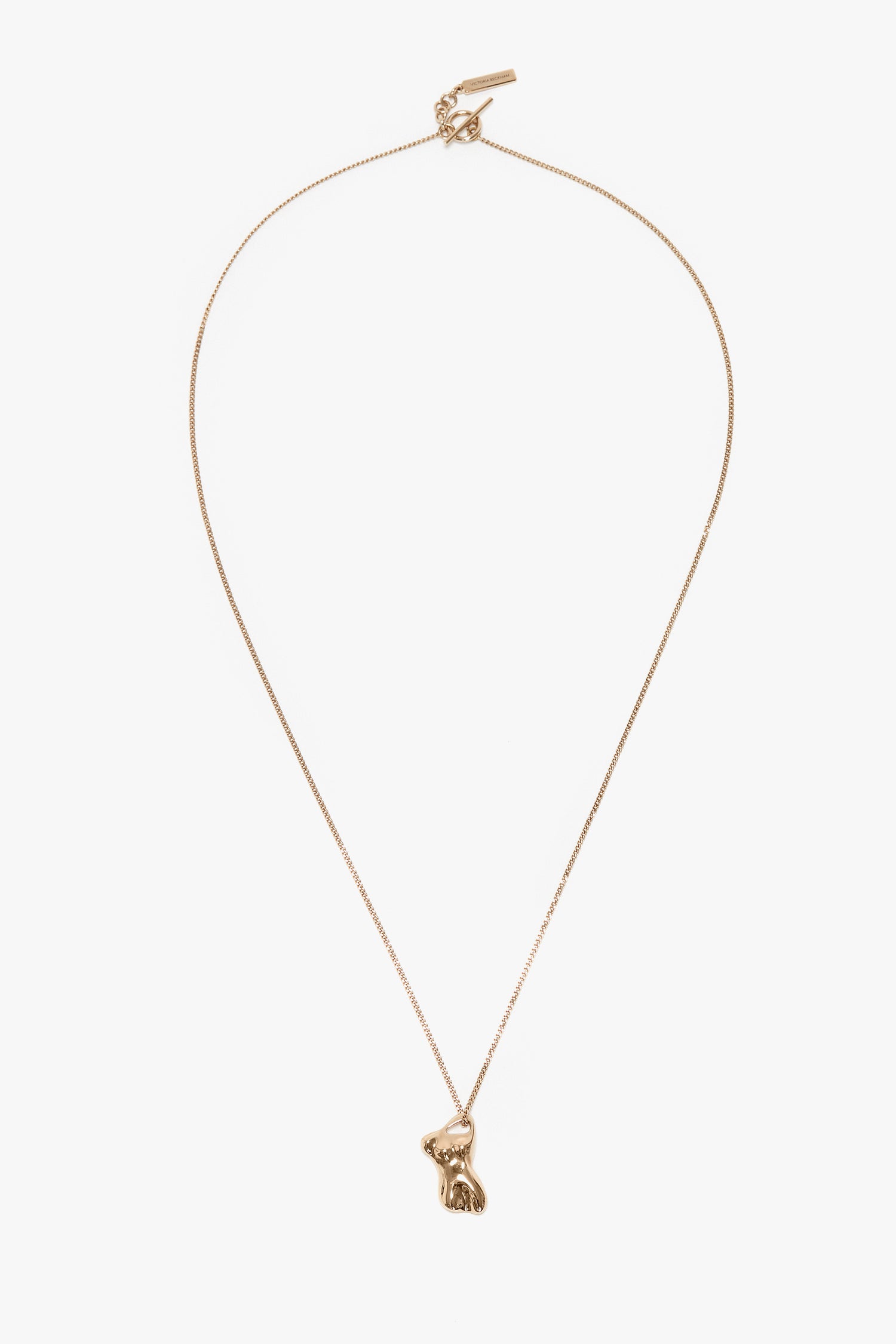 Exclusive Body Charm Necklace In Light Gold by Victoria Beckham with a thin chain featuring a small fox-shaped pendant, crafted from 100% brass.