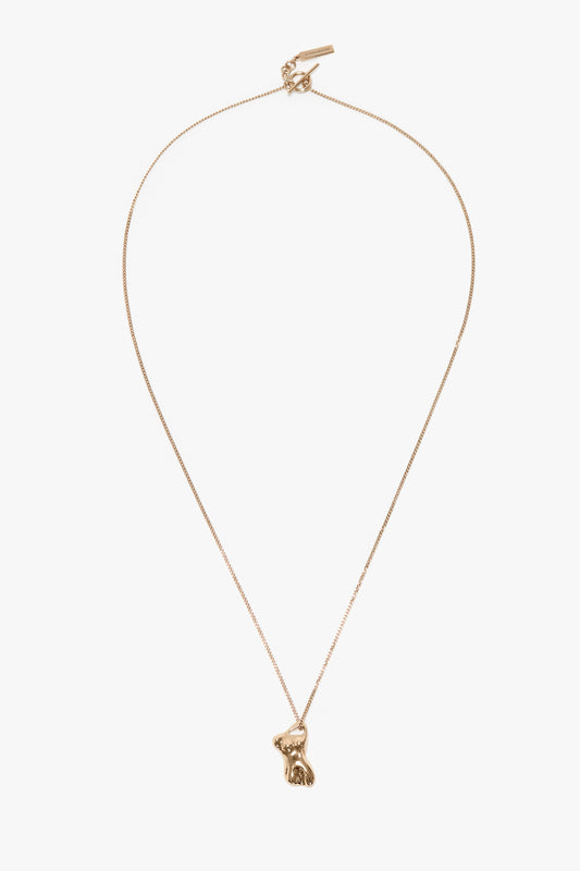 Exclusive Body Charm Necklace In Light Gold by Victoria Beckham with a thin chain featuring a small fox-shaped pendant, crafted from 100% brass.