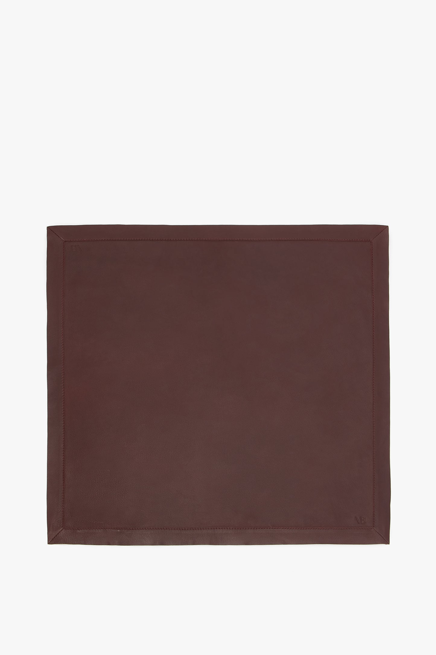 A rectangular brown Leather Scarf In Bordeaux with a bordered edge, reminiscent of the sleek lines found in masculine tailoring, by Victoria Beckham.