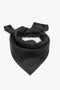 A Victoria Beckham Leather Scarf In Black, crafted from supple leather, is folded and placed against a pristine white background.