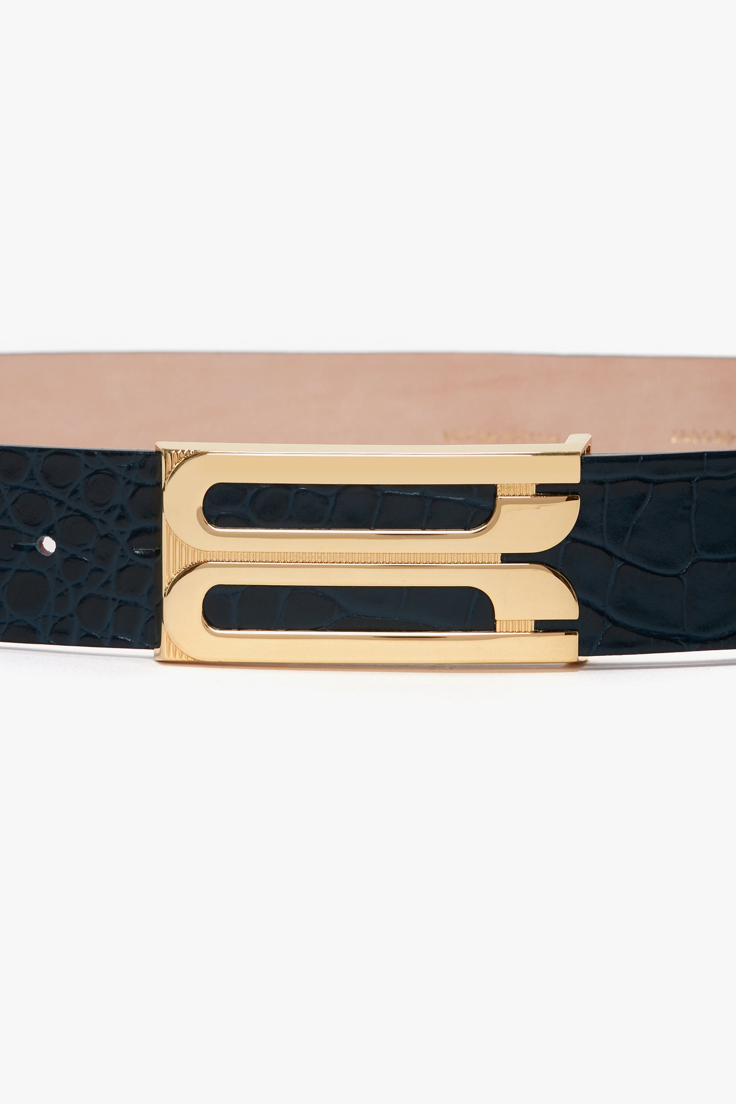 Close-up of the Victoria Beckham Jumbo Frame Belt In Midnight Blue Croc Embossed Calf Leather featuring a gold rectangular buckle and a black croc-embossed calf leather strap.