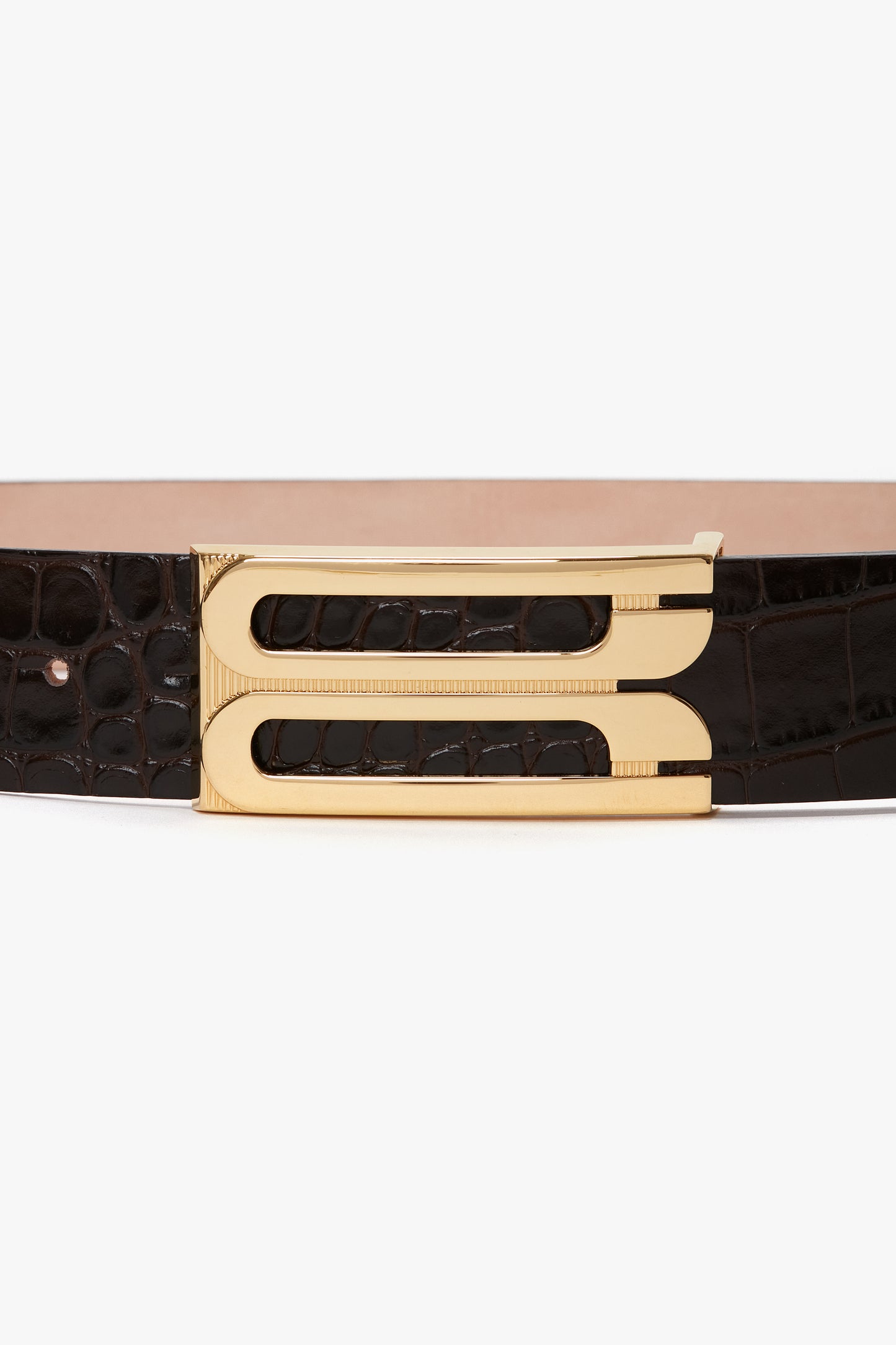 A Jumbo Frame Belt In Espresso Croc Embossed Calf Leather by Victoria Beckham featuring luxury gold hardware and a sleek rectangular buckle.