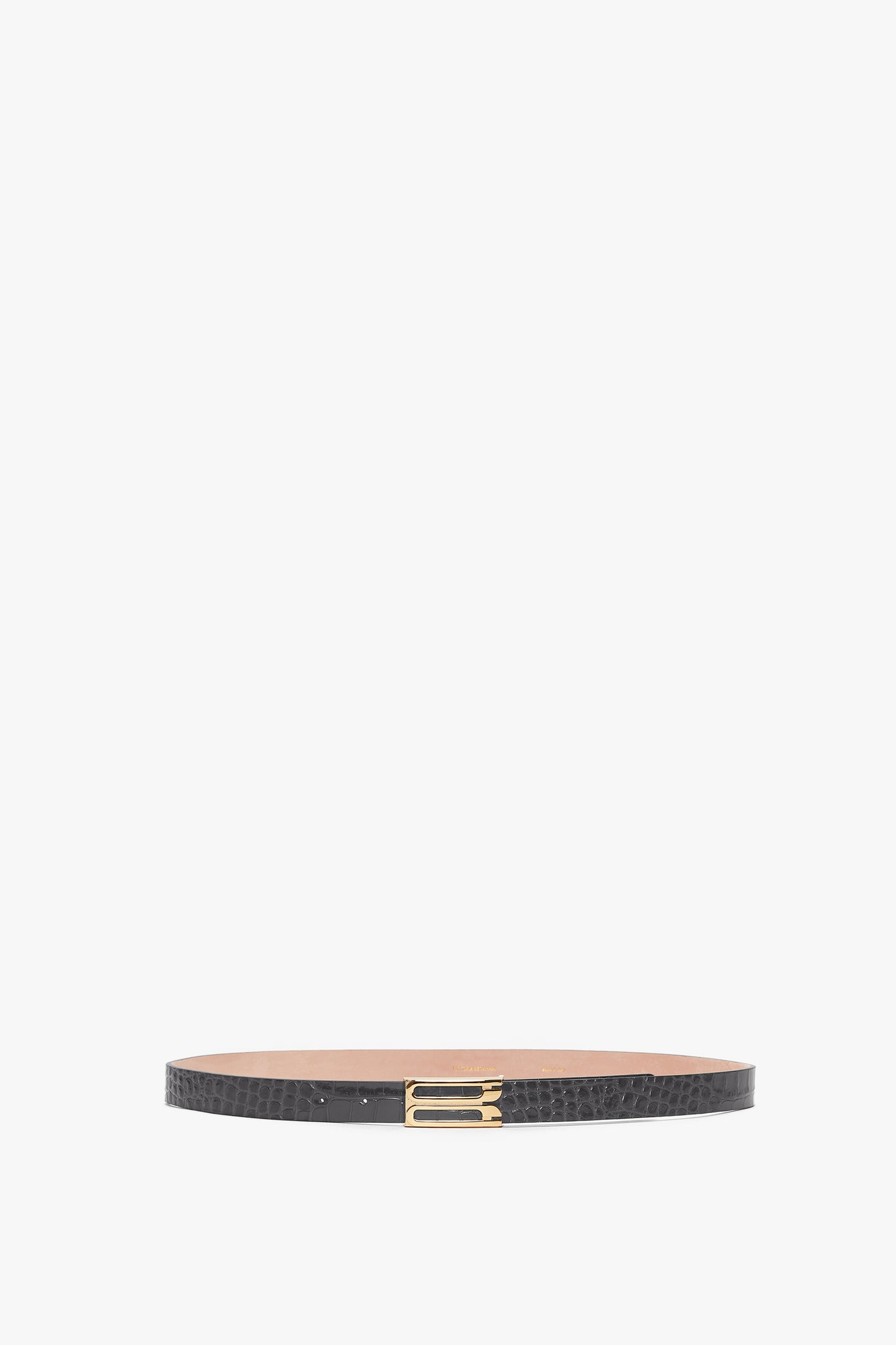 A slim **Frame Belt In Slate Grey Croc Embossed Calf Leather** made from croc-embossed calf leather, featuring a textured pattern and a rectangular gold buckle with elegant gold hardware.
