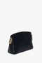 A black leather handbag with gold hardware, featuring a geometric design and a zip closure, shown against a white background. This Exclusive Victoria Crossbody Bag In Navy Leather by Victoria Beckham also boasts a branded padlock for added elegance.