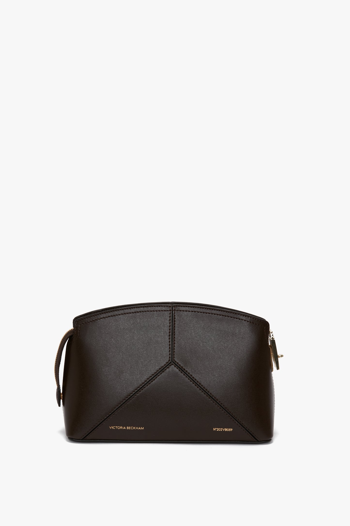 A sleek black Victoria Beckham Exclusive Victoria Crossbody Bag In Brown Leather crafted from calf leather with a geometric design and gold-lettered text near the bottom, on a white background.