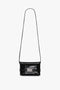 A black calf leather crossbody bag with an embossed crocodile print, a long strap, and a silver buckle on the front. The Mini B Pouch Bag In Croc Effect Black Leather by Victoria Beckham.