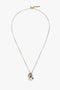 A Victoria Beckham Exclusive Resin Pendant Necklace In Light Gold-White with a 31cm-long delicate chain, featuring a white pendant with black accents and an additional small light gold ring near the pendant.