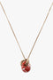 Victoria Beckham Exclusive Resin Pendant Necklace In Light Gold-Orange with a resin pendant featuring a red and white marbled design and two interlocking 100% brass rings in light gold/orange.