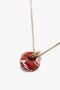 Exclusive Resin Pendant Necklace In Light Gold-Orange by Victoria Beckham, with a circular red and white marbled resin pendant, crafted from 100% brass.