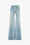 The Victoria Beckham Bianca Jean In Light Blue Denim features light blue denim, high-waisted and wide-leg, with a faded wash and pronounced centre seam detail down the front of each leg.