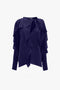 A navy blue, long-sleeved Tie Detail Ruffle Blouse In Ultraviolet by Victoria Beckham with ruffled details and a tie detail at the V neckline.