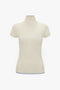 A cream-colored, short-sleeved, Polo Neck Knitted T-Shirt In Cream by Victoria Beckham with subtle textured patterns and pointelle stitch details, displayed on a plain white background.