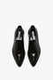 Top view of a pair of Victoria Beckham Pointy Toe Flat Lace Up In Black Brushed Leather shoes with a pointy toe silhouette.