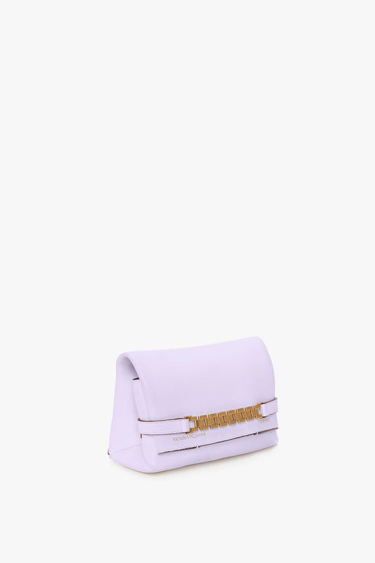A Victoria Beckham EXCLUSIVE Mini Chain Pouch With Long Strap In Lilac Leather, placed against a white background.