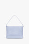 Light blue Chain Pouch With Strap In Frost Ostrich-Effect Leather by Victoria Beckham, featuring a single strap and gold chain detail.