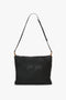 A Puffy Jumbo Chain Pouch In Black Leather by Victoria Beckham with a simple, adjustable shoulder strap and minimalist design, set against a white background.