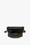 A black sheepskin nappa leather Puffy Jumbo Chain Pouch In Black Leather by Victoria Beckham with an open zipper reveals a suede-lined interior. The bag has an adjustable shoulder strap attached with gold hardware.