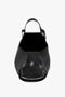 A Victoria Beckham W11 Jumbo Tote Bag In Black Leather with an open top view, revealing a spacious interior featuring an internal pocket compartment and adjustable shoulder straps.