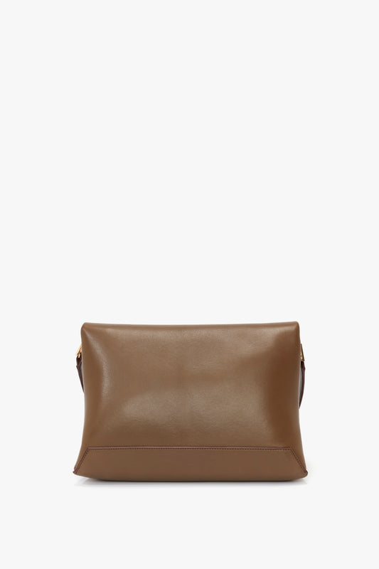 A Chain Pouch Bag With Strap In Khaki Leather with a simple, sleek design crafted from supple Nappa leather and no visible embellishments or hardware. It features a discreet, detachable strap for added versatility by Victoria Beckham UK.