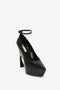 A Victoria Beckham Ankle Strap Wedge Pump In Black Croc-Effect Leather, viewed from a 3/4 angle.