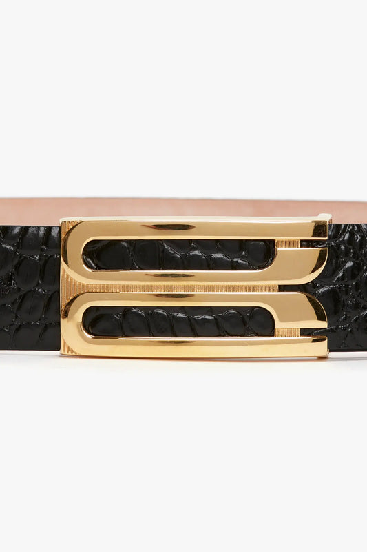 A Jumbo Frame Belt In Black Croc Embossed Calf Leather, featuring luxury gold hardware in the form of a large double "F" buckle, by Victoria Beckham.