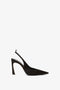 Side view of a Victoria Beckham Pointy Toe Satin Sling Back Pump In Black against a white background.