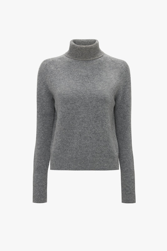 A Victoria Beckham Polo Neck Jumper In Grey Melange is displayed against a plain white background, showcasing its versatile styling options.
